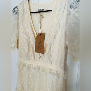 Brand Lysticle, Color Blue. Other is Ivory. Size Small